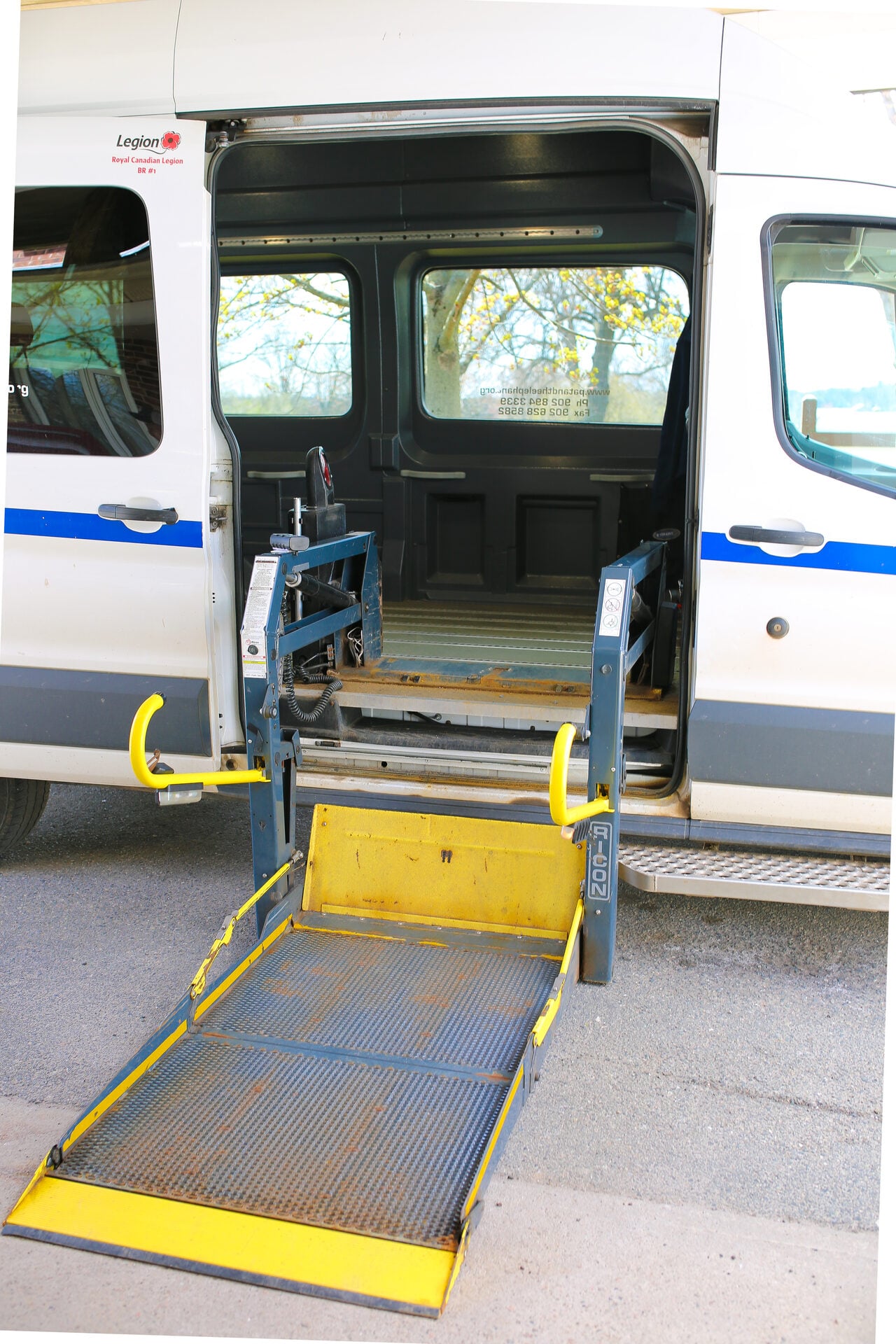 Pat & The Elephant accessible transportation van, side view showing accessibility markings