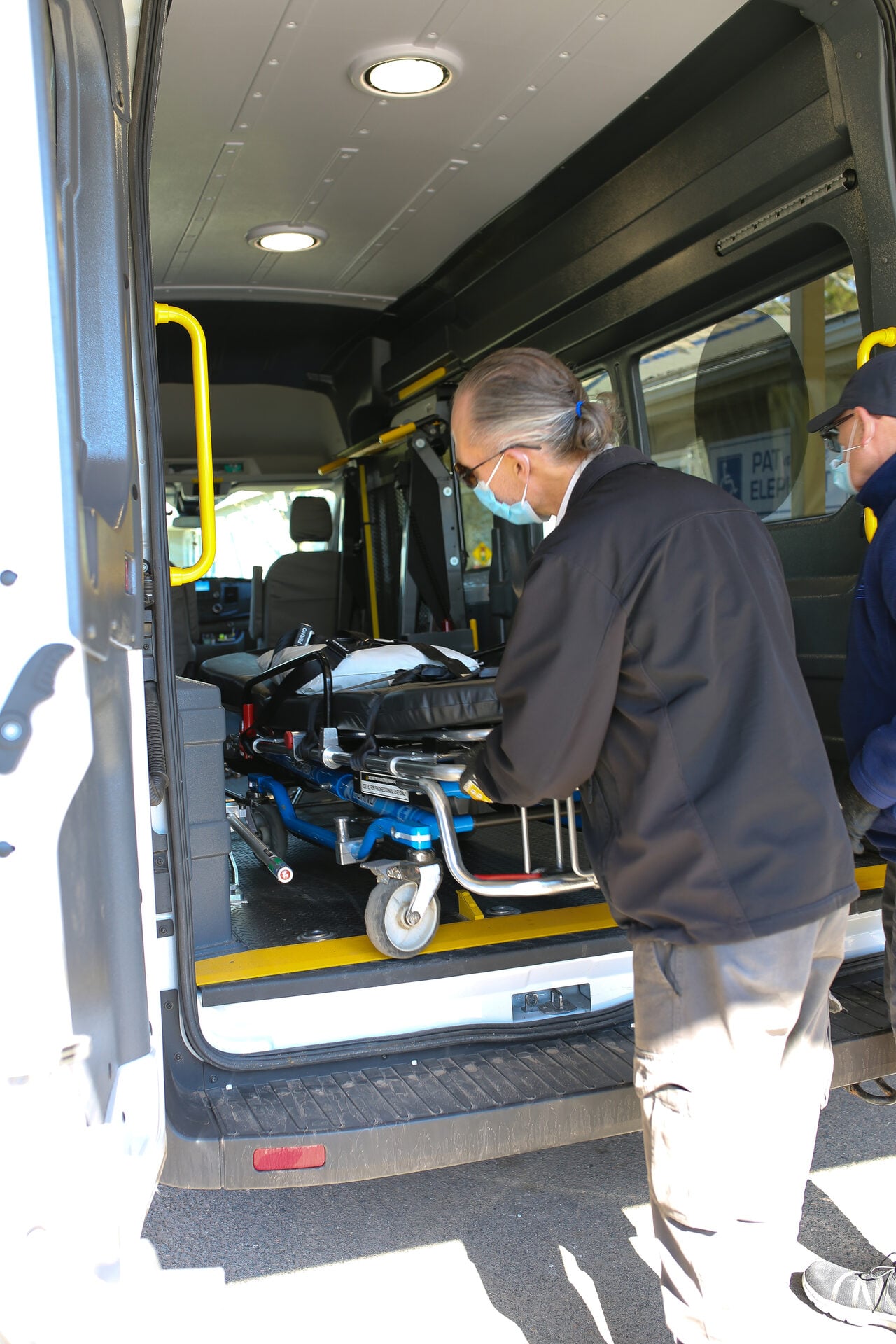 Pat & The Elephant fleet vehicle exterior, accessible ramp visible, parked in community setting