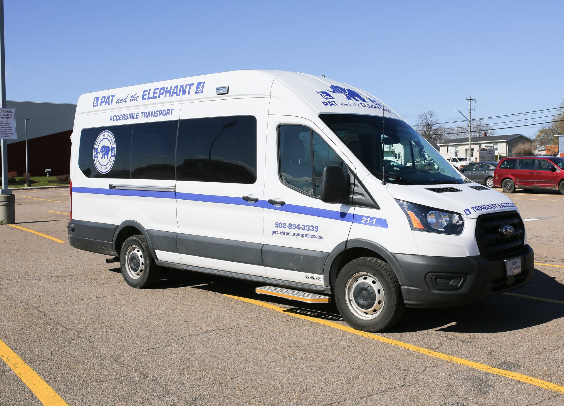Pat & The Elephant fleet vehicle parked outdoors, clear day, accessible ramp visible on the side of the van